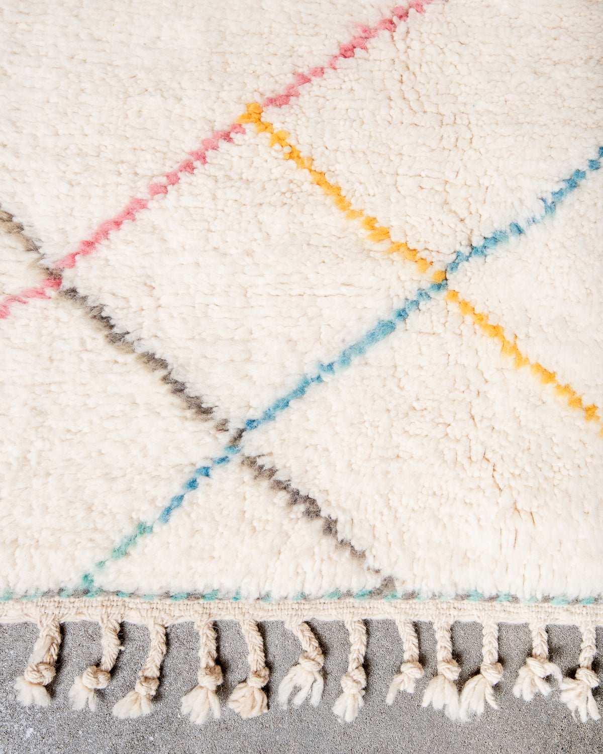 Modern, designer, handcrafted Berber rug from Morocco. Beniourain carpet with beautiful colours and patterns and fluffy wool texture.